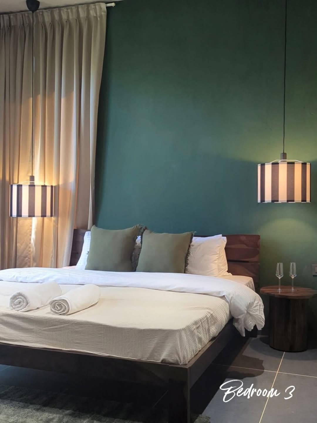 Bedroom with green accent wall